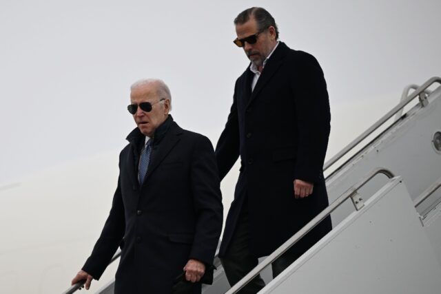 US President Joe Biden, with son Hunter Biden, disembarks from a plane in February 2023