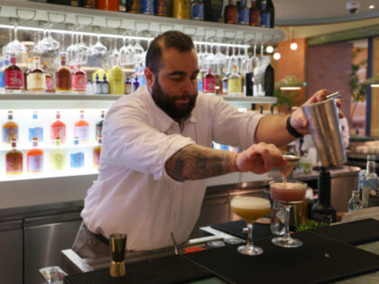 Lebanese bartender Hadi Ghassan prepares a drink behind the counter at "Meraki Riyadh", a