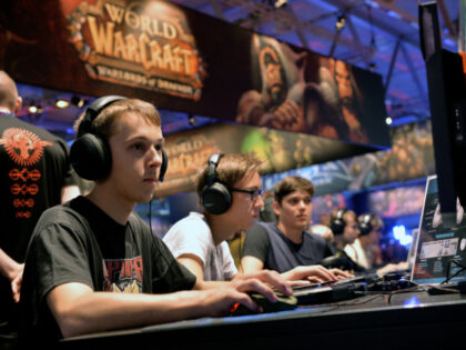 COLOGNE, GERMANY - AUGUST 14: Visitors try out the massively multiplayer online role-playi
