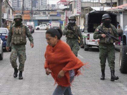 Soldiers patrol the perimeter of Inca prison during a state of emergency in Quito, Ecuador