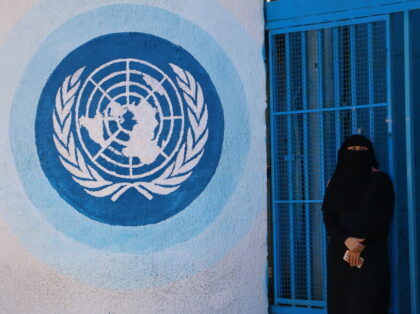 GAZA, PALESTINE - 2018/07/29: A woman stands in front of UNRWA headquarters during the pro