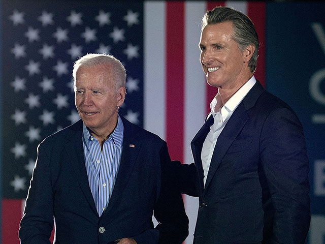 California Governor Gavin Newsom (L) greets US President Joe Biden during a campaign event