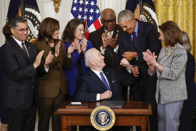 WASHINGTON, DC - APRIL 5: U.S. President Joe Biden fist bumps former President Barack Obama after Biden signed an executive order aimed at strengthening the Affordable Care Act during an event to mark the 2010 passage of the Affordable Care Act in the East Room of the White House on …