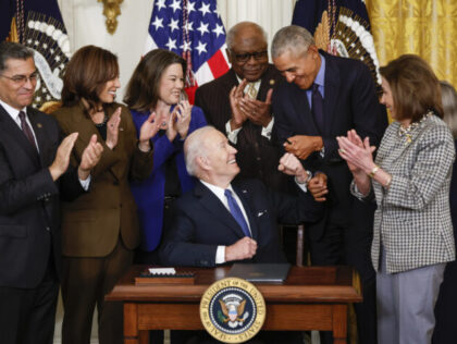 WASHINGTON, DC - APRIL 5: U.S. President Joe Biden fist bumps former President Barack Obam