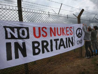 LAKENHEATH, ENGLAND - MAY 21: Various flags and banners supporting CND and peace are fixed