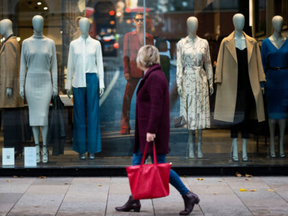 CARDIFF, WALES - OCTOBER 21: A woman walks past mannequins in a Reiss store on October 21,