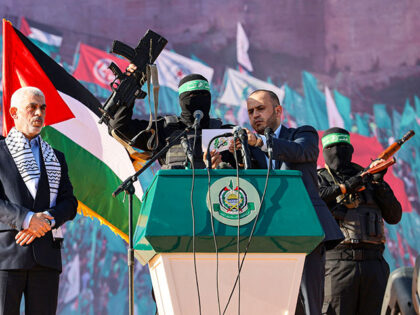 Yahia al-Sinwar (2nd-L), Gaza Strip chief of the Palestinian Islamist Hamas movement, stan