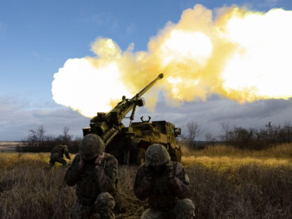 Ukrainian servicemen fire with a CAESAR self-propelled howitzer towards Russian positions
