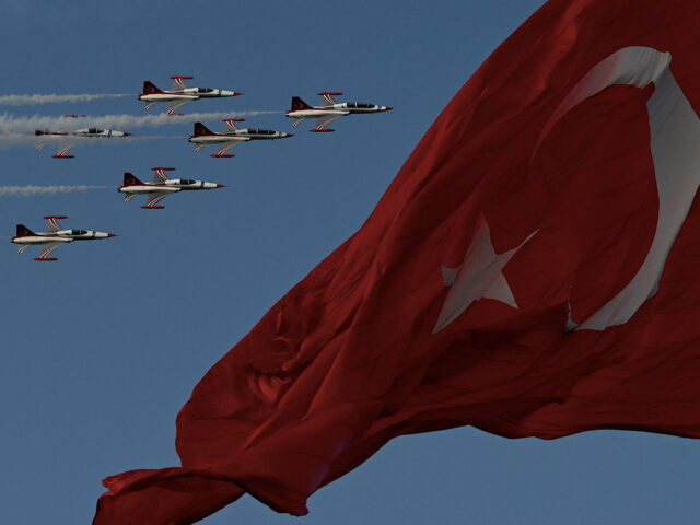 TOPSHOT - Turkish Air force pilots of the 'Turkish Stars' fly in Northrop F-5 near a national flag to mark the 100th anniversary of Turkish Republic in Istanbul on October 29, 2023. Turkey marked its centenary as a post-Ottoman republic on October 29, 2023, with somewhat muted celebrations held in …
