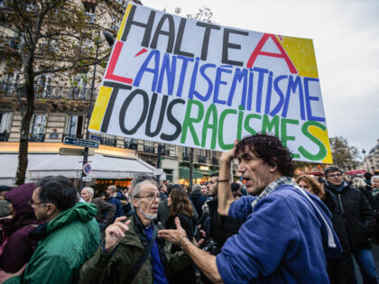PARIS, FRANCE - 2023/11/12: A protester holds a placard that says "Stop the antisemit