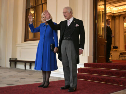 LONDON, ENGLAND - NOVEMBER 23: King Charles III and Queen Camilla wave during a formal far