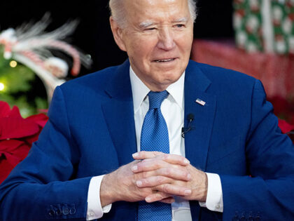 President Joe Biden looks on as First Lady Jill Biden as reads "'Twas The Night Before Chr