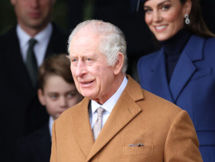 Britain's King Charles III waits on the church steps after attending the Royal Family