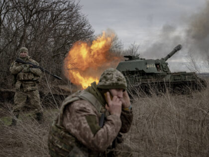 DONETSK OBLAST, UKRAINE - DECEMBER 28: A Ukrainian soldier fires towards the Russian posit