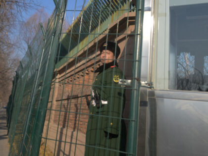 A Chinese paramilitary police stands guard outside the British embassy in Beijing on Janua