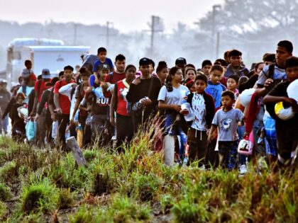 Migrants take part in a caravan towards the border with the United States in Arriaga commu