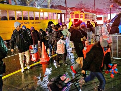 CNN - UNITED STATES -January 9: Migrants evacuated from Floyd Bennett Field arrive at Jame