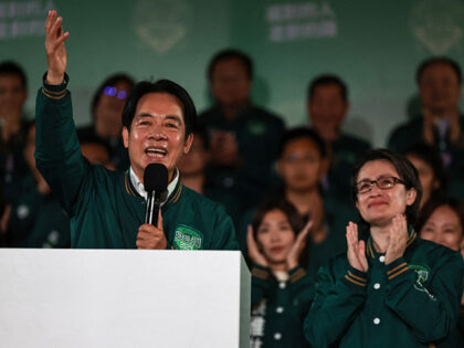 Taiwan's President-elect Lai Ching-te (L) gestures beside his running mate Hsiao Bi-k