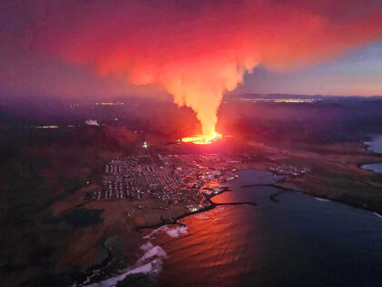 TOPSHOT - Billowing smoke and flowing lava are seen in this Icelandic Department of Civil