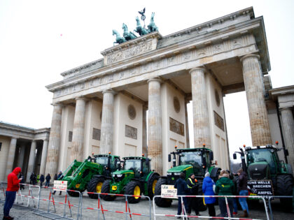 BERLIN, GERMANY - JANUARY 15: Tractors of protestors stand in front of Brandenburg gate du