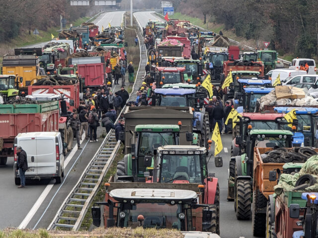 AGEN, FRANCE - JANUARY 22: Farmers with nearly 200 tractors block the A62 freeway to hold