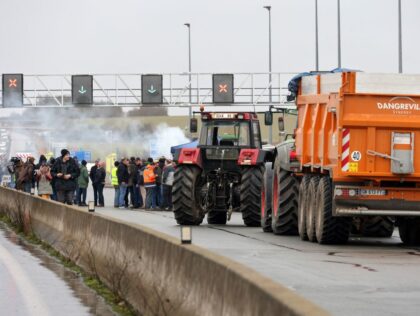 Farmers use tractors to block the A29 motorway at Boves near Amiens, northern France on Ja