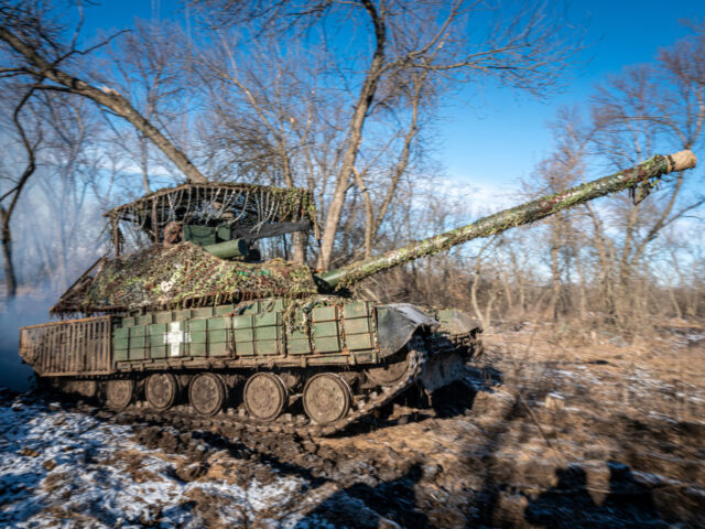 DONETSK OBLAST, UKRAINE - JANUARY 23: Ukrainian soldiers ride a tank to the frontline in t