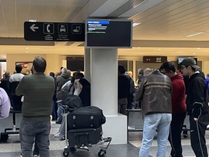 BEIRUT, LEBANON - JANUARY 07: Passengers wait as a cyberattack targets the screens of depa