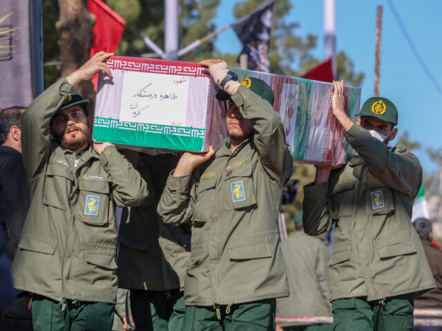 KERMAN, IRAN - JANUARY 5: Coffins carried by Revolutionary guard soldiers during the funer