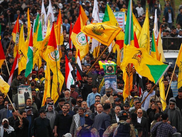 Iraqi mourners carry the coffin of Fadel al-Maksusi, a Kataeb Hezbollah fighter who was also part of the "Islamic resistance in Iraq", the group that has claimed all recent attacks against US troops in Iraq and Syria, during a funeral in Baghdad on November 21, 2023. According to security sources, …