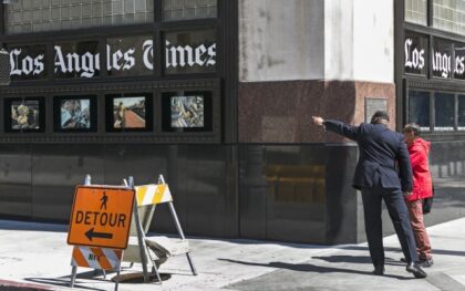 A pedestrian asks for directions outside the Los Angeles Times building in downtown Los An