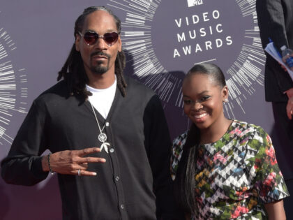 US musician Snoop Dogg (L) arrives with his daughter Cori Broadus on the red carpet for th