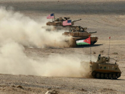 A Jordanian armored personnel carrier and U.S. tanks take part in the "Eager Lion" multina