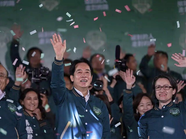 Taiwanese Vice President Lai Ching-te, also known as William Lai, left, celebrates his vic