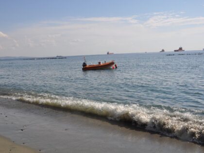 A boat is near the beach shore (Stock photo via Getty).