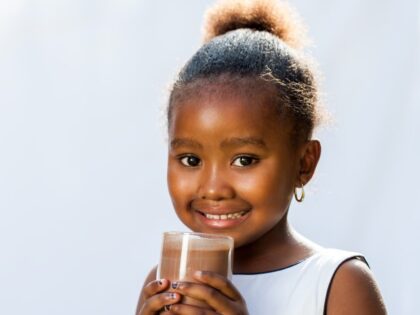 child drinking chocolate milk