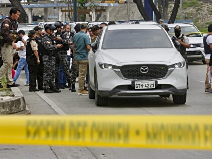 Members of the National Police remain in the place where Prosecutor Cesar Suarez was shot