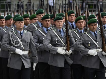 An honour guard marches out at the end of a swearing-in ceremony of German Bundeswehr sold