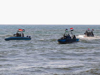 Members of the Yemeni Coast Guard affiliated with the Houthi group patrol the sea as demon