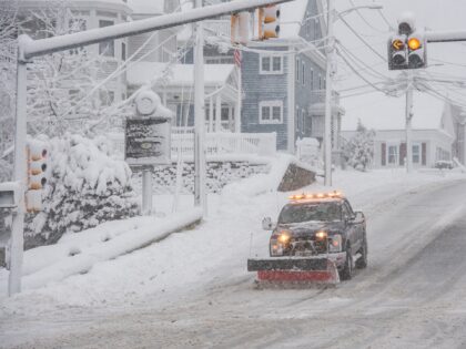 A snowplow clears snow from Broadway in Methuen, Massachusetts on January 7, 2024. Forecas