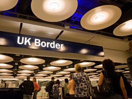 Queues of newly-arrived airline passengers line up to await their turn at the UK Border Ag