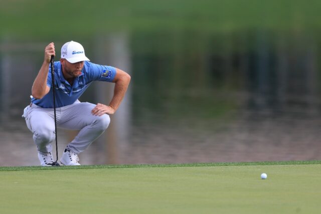 American Sam Burns lines up a putt on the way to an 11-under par 61 and the second-round l