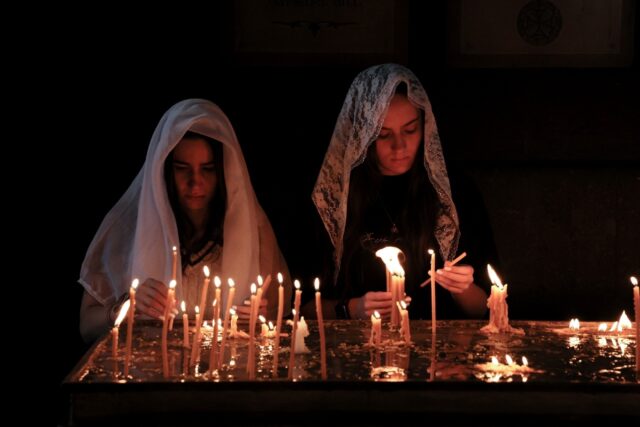 Armenians pray during a service for refugees from Nagorno-Karabakh, seized back from Azerb