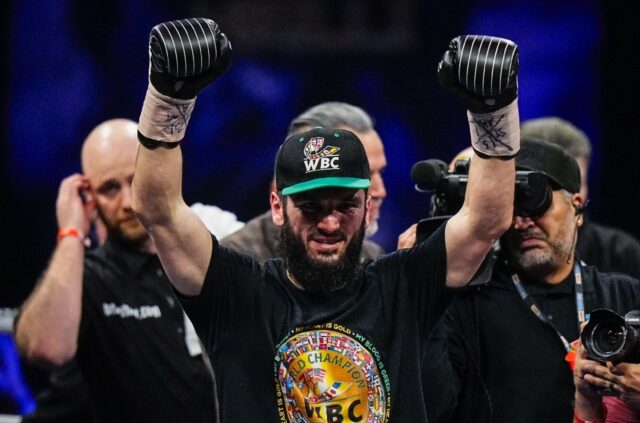 Canada's Artur Beterbiev celebrates his victory against Britain's Callum Smith in their WB