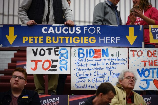 Caucus goers wait to be counted at their precinct at Abraham Lincoln High School in Des Mo