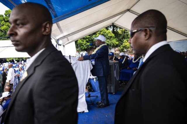 Comoros President Azali Assoumani (C) is favourite to win another term in office after Sun