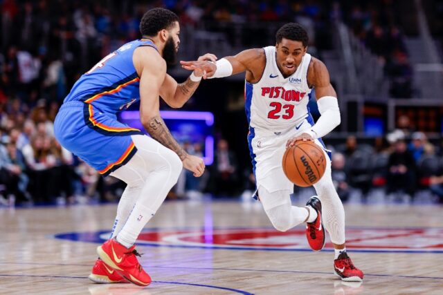 Detroit's Jaden Ivey drives past Kenrich Williams in the Pistons' NBA victory over the Ok