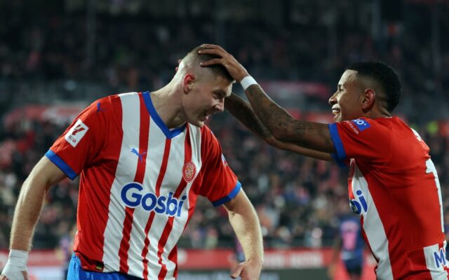 Girona's Ukrainian forward Artem Dovbyk (L) celebrates scoring his hat-trick as his side t