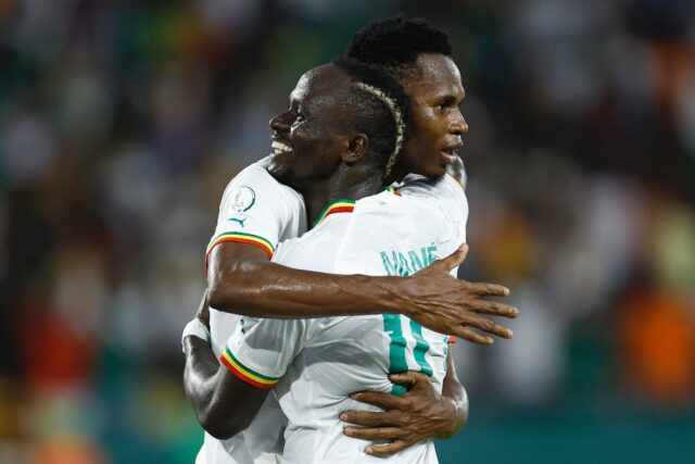 Habib Diallo (L) is hugged by Sadio Mane after scoring the second Senegal goal against Cam