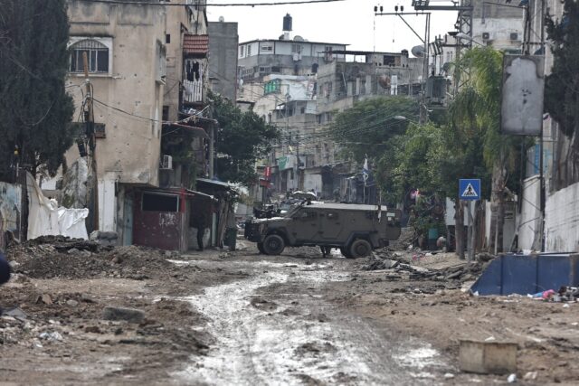 Israeli troops block off roads during a raid on Tulkarem refugee camp in the occupied West